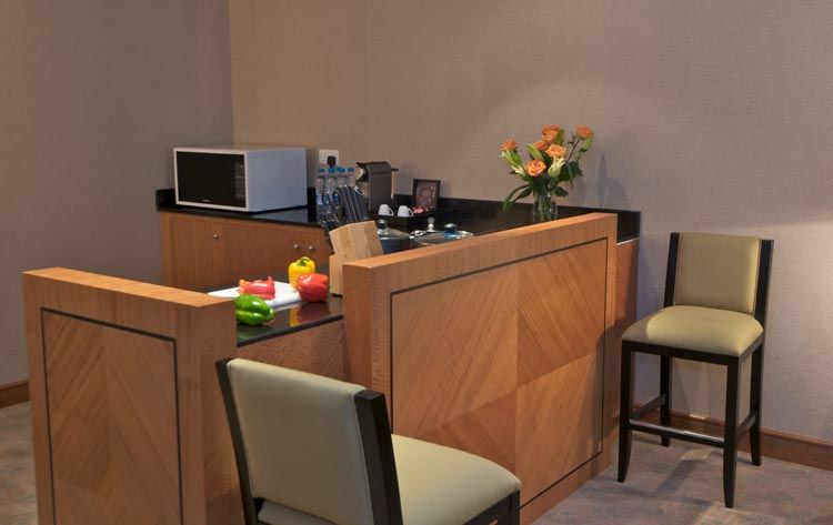 Wiseman Grand Hotel Doha Exteriör bild A small kitchen in a hotel suite