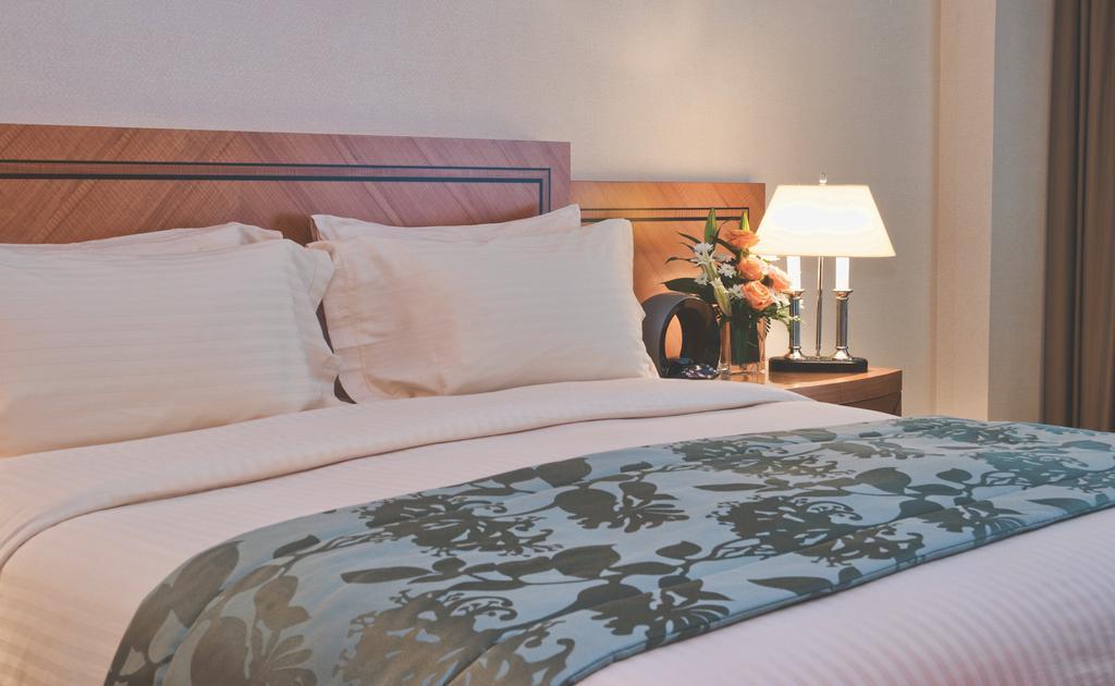 Wiseman Grand Hotel Doha Exteriör bild A bed runner